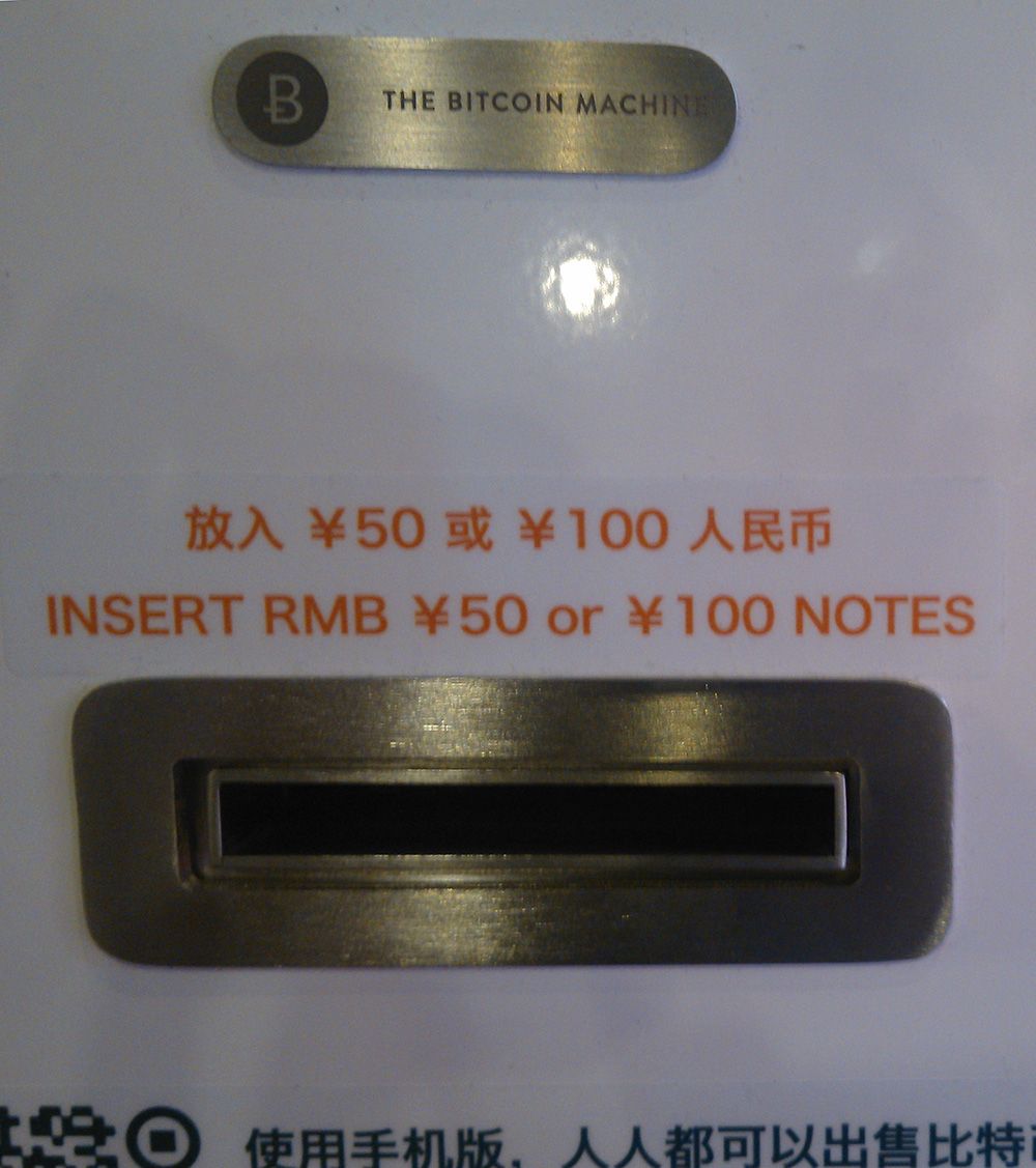 Insert a Bill into Chinese bitcoin ATM